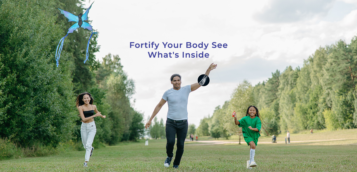 Family enjoying outdoor activities, with a man throwing a frisbee and a child flying a kite, accompanied by the inspirational message 'Fortify Your Body See What's Inside' overlaid on the image.